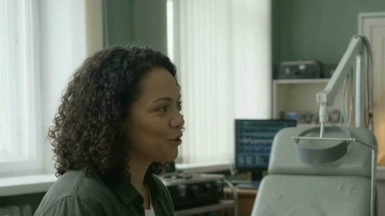 Maya interviewing Vale in the laboratory